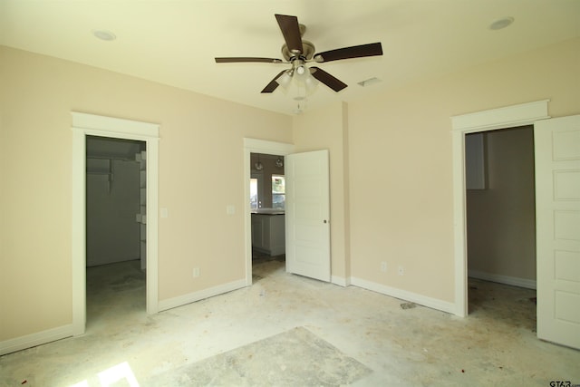 1209 S Butler Ave, Tyler, TX 75701 - unfurnished bedroom with a walk in closet, a closet, and ceiling fan