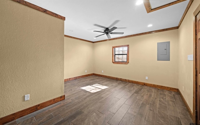 empty room featuring ornamental molding, ceiling fan, and electric panel