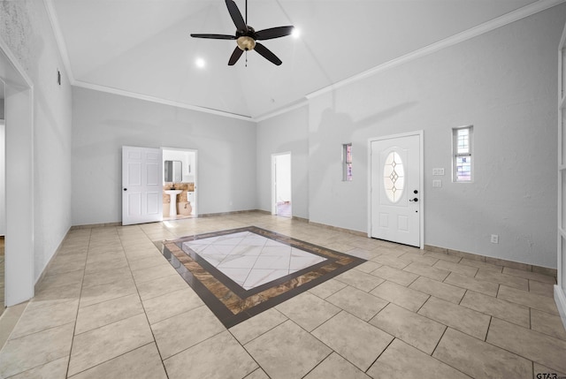 tiled foyer entrance with ceiling fan, high vaulted ceiling, and ornamental molding