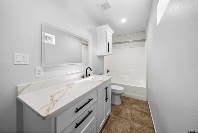 full bathroom with vanity, toilet, and tiled shower / bath