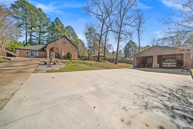 exterior space featuring a garage and an outbuilding