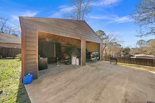 exterior space with a garage and an outdoor structure