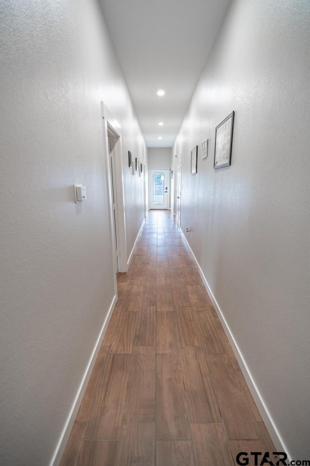 hallway featuring hardwood / wood-style floors