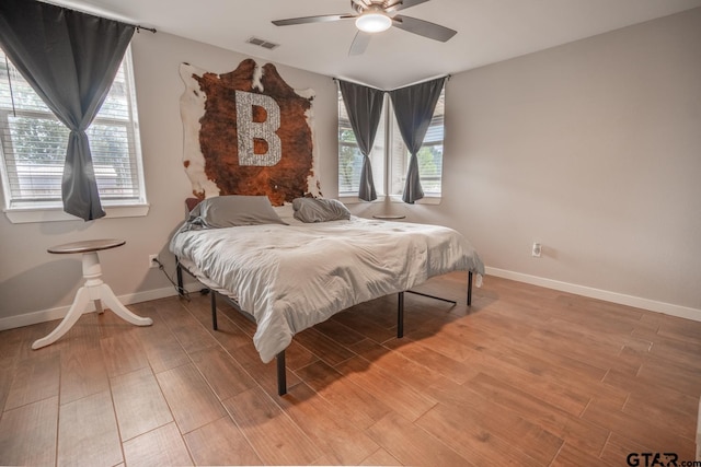 bedroom featuring wood-type flooring and ceiling fan