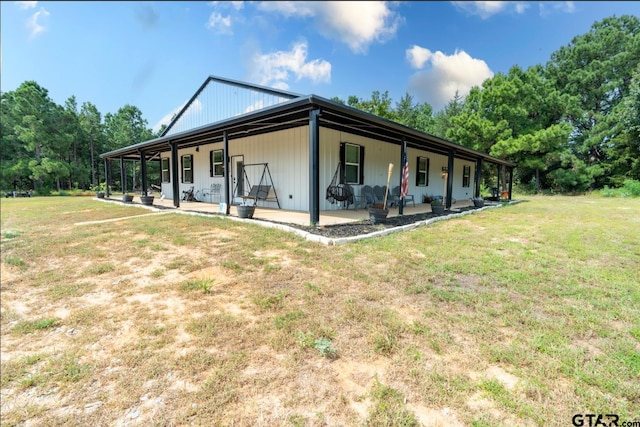 exterior space featuring a patio area and a lawn