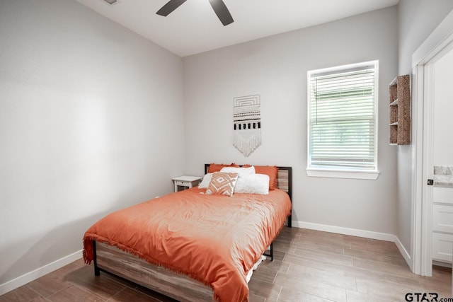 bedroom featuring hardwood / wood-style floors and ceiling fan