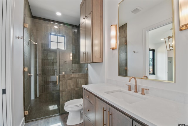 3312 Forest Ct, Tyler, TX 75703 - full bath featuring toilet, vanity, a shower stall, and recessed lighting