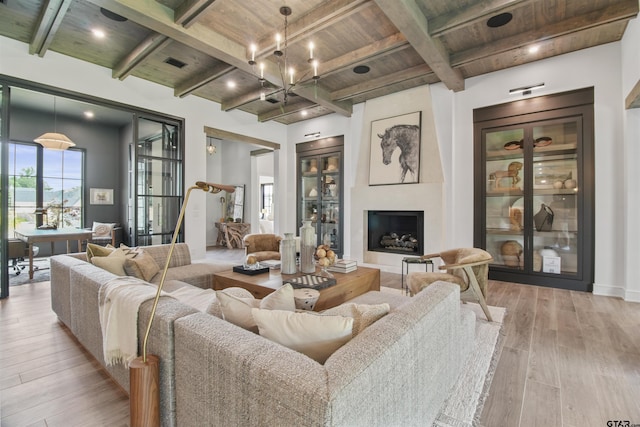3312 Forest Ct, Tyler, TX 75703 - living room with wood ceiling with exposed beams, light wood finished floors, a large fireplace, and baseboards