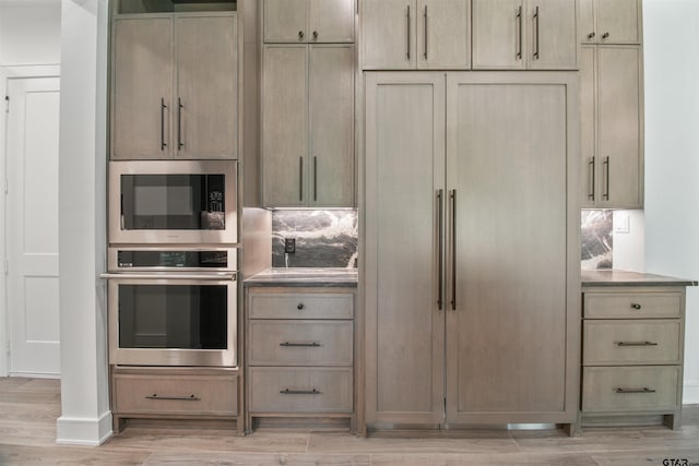 3312 Forest Ct, Tyler, TX 75703 - kitchen with appliances with stainless steel finishes, light wood finished floors, and baseboards