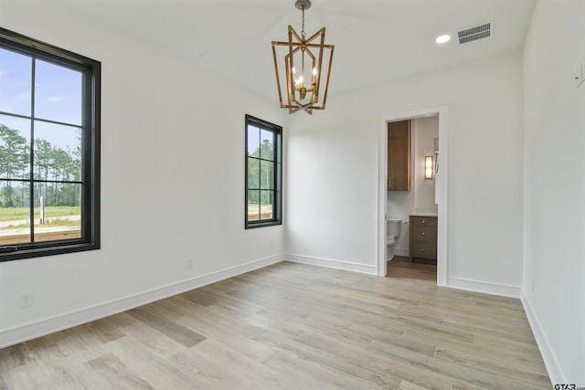 3312 Forest Ct, Tyler, TX 75703 - spare room featuring a chandelier, light wood-type flooring, baseboards, and recessed lighting