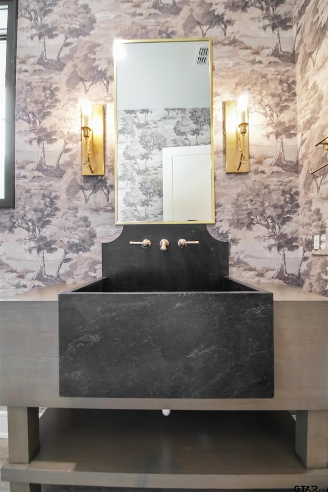 3312 Forest Ct, Tyler, TX 75703 - bathroom featuring wallpapered walls and a sink