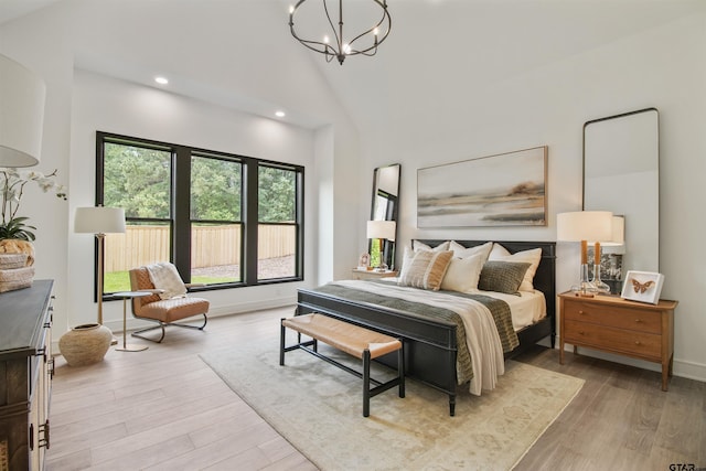 3312 Forest Ct, Tyler, TX 75703 - bedroom with wood finished floors, a chandelier, recessed lighting, baseboards, and high vaulted ceiling