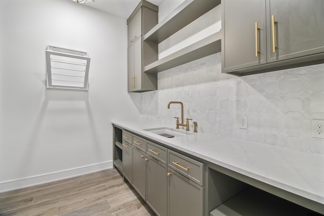 3312 Forest Ct, Tyler, TX 75703 - kitchen featuring gray cabinetry, open shelves, a sink, tasteful backsplash, and light wood-style flooring