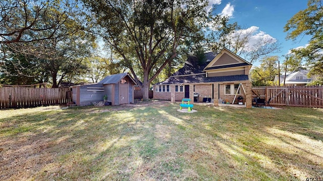 view of yard featuring a storage unit and a patio area