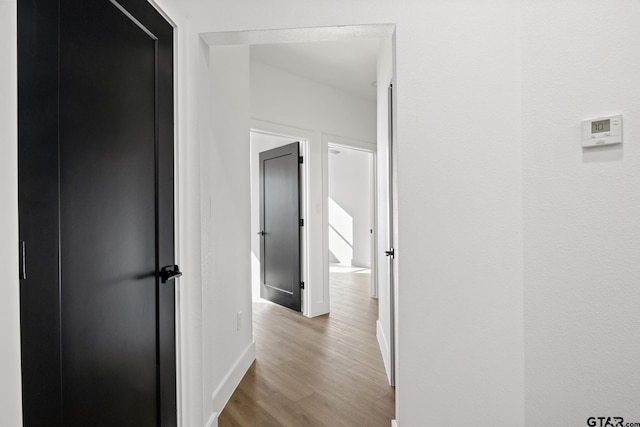 hall with light wood-type flooring