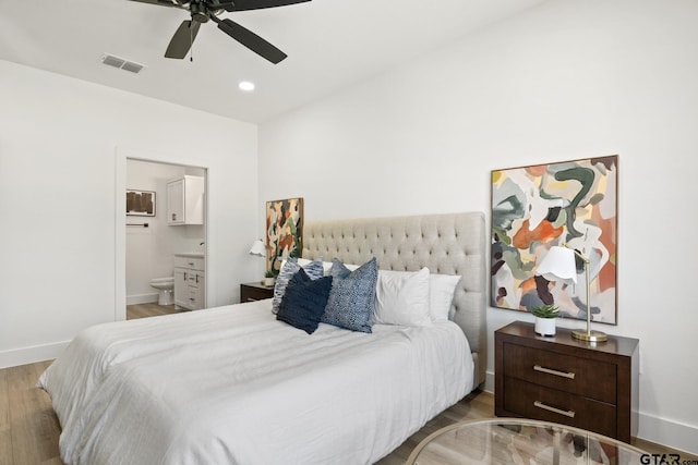 bedroom with ceiling fan, connected bathroom, and light wood-type flooring