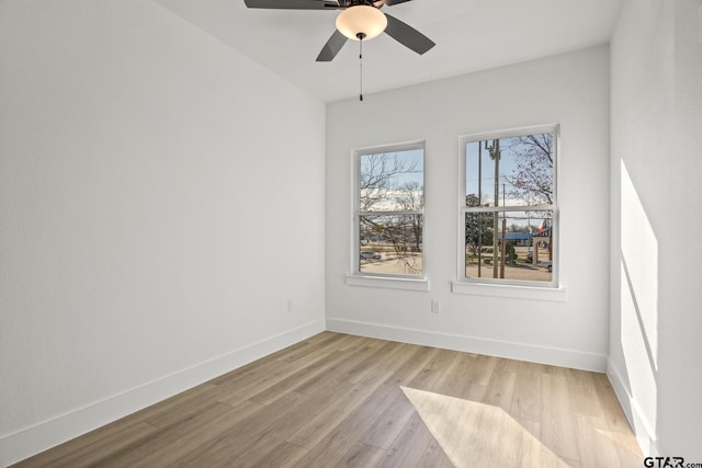 unfurnished room with ceiling fan and light hardwood / wood-style flooring