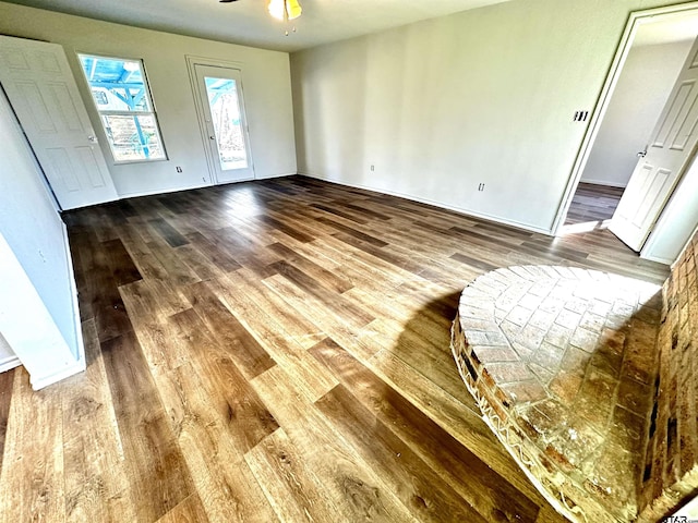 entryway with ceiling fan and wood-type flooring