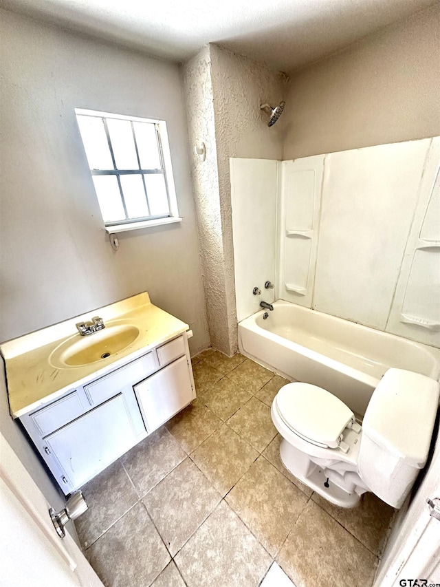 full bathroom featuring tile patterned floors, vanity, toilet, and bathtub / shower combination