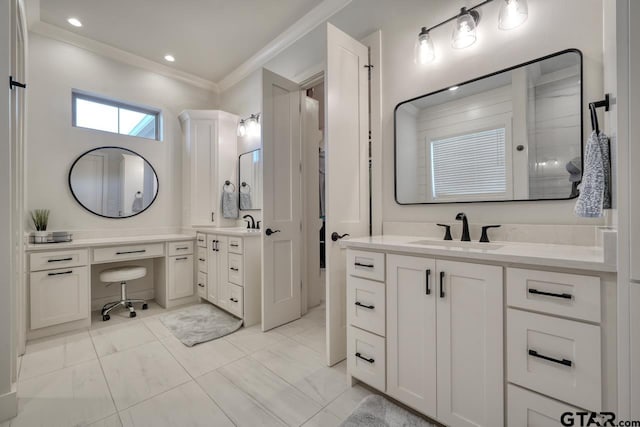 bathroom featuring ornamental molding and vanity