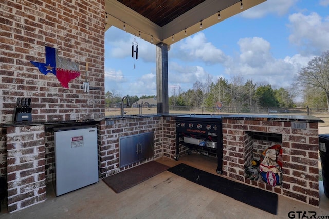 view of patio / terrace featuring sink and area for grilling