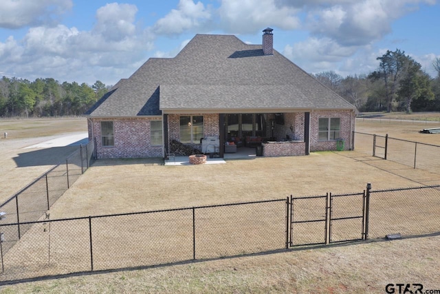 back of property with a patio area