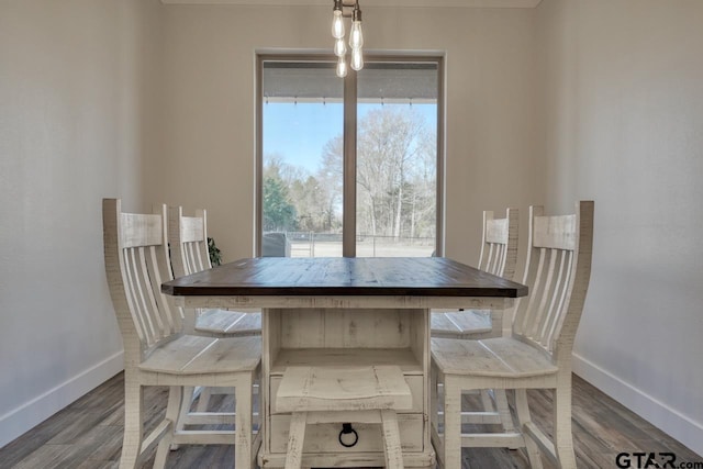 unfurnished dining area featuring dark hardwood / wood-style flooring