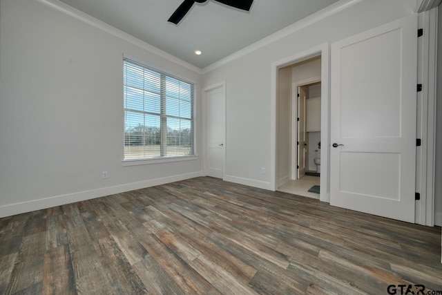 unfurnished bedroom featuring ceiling fan, dark hardwood / wood-style flooring, and ornamental molding