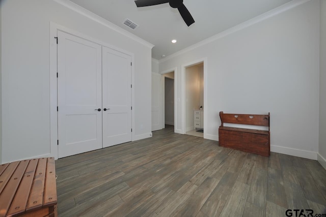 unfurnished bedroom with a closet, ceiling fan, ornamental molding, and dark hardwood / wood-style floors