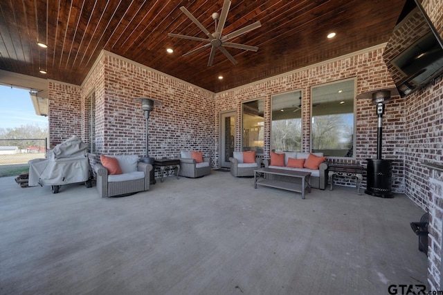 view of patio with ceiling fan and an outdoor living space