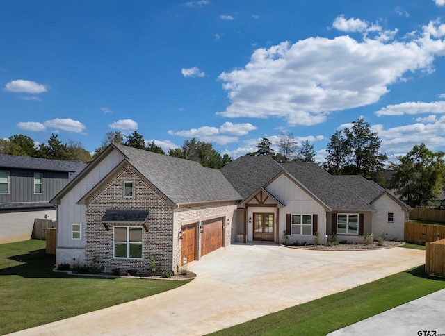 view of front of property featuring a garage and a front lawn