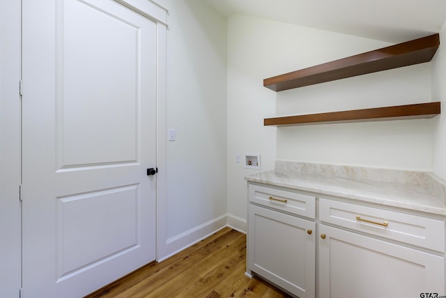 interior space featuring white cabinetry and light hardwood / wood-style floors