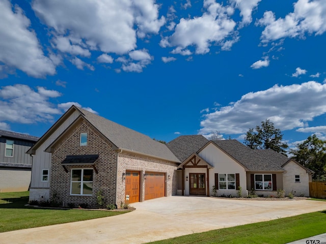 view of front of home featuring a garage and a front lawn