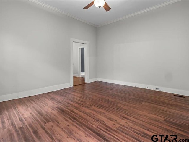 spare room with dark wood-type flooring, ceiling fan, and crown molding