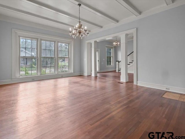 interior space featuring hardwood / wood-style flooring, beamed ceiling, and ornamental molding