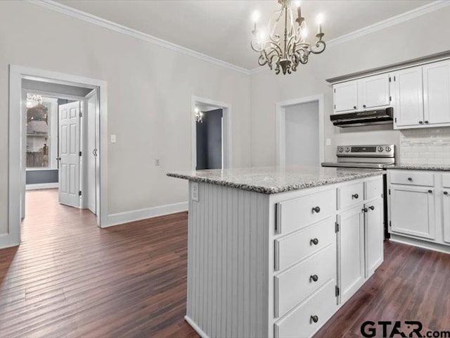 kitchen with dark hardwood / wood-style flooring, white cabinets, decorative light fixtures, and a center island