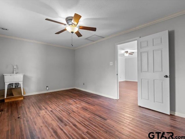 empty room with ceiling fan, dark hardwood / wood-style floors, and crown molding