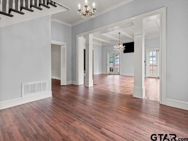 interior space featuring ornate columns, a notable chandelier, hardwood / wood-style flooring, ornamental molding, and beamed ceiling