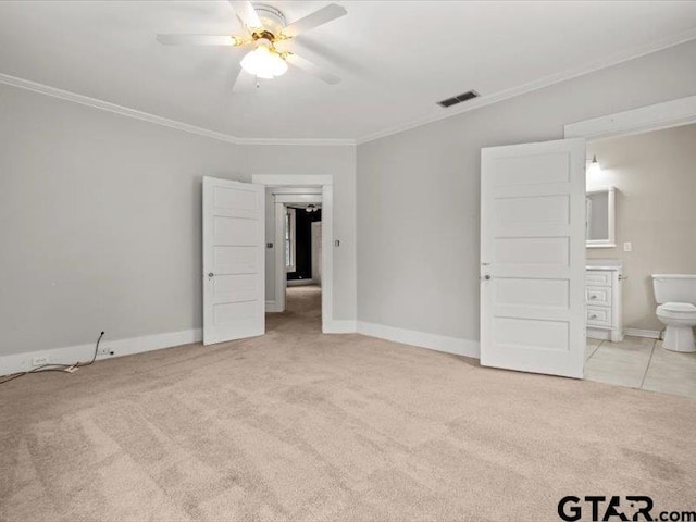 unfurnished bedroom with connected bathroom, light carpet, ceiling fan, and crown molding