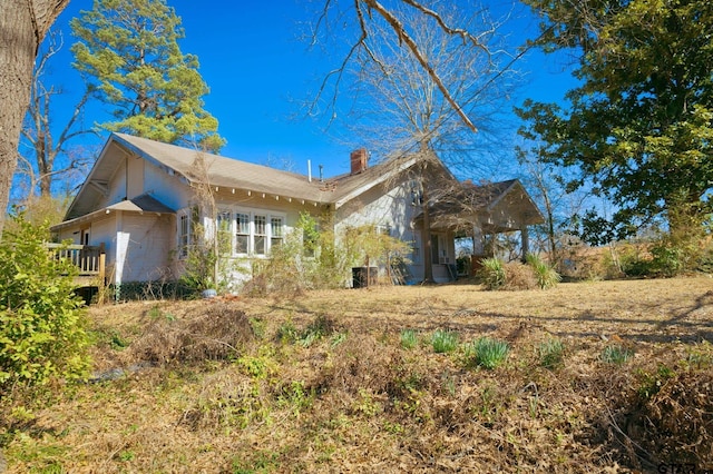 exterior space featuring a chimney