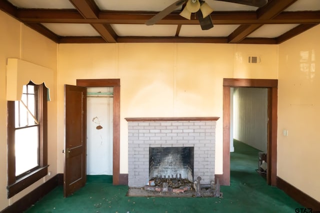 unfurnished living room with beamed ceiling, a brick fireplace, coffered ceiling, and visible vents