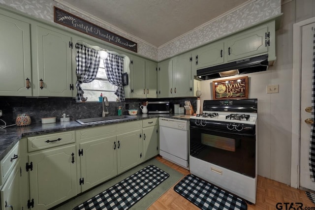 kitchen with dishwasher, crown molding, under cabinet range hood, a sink, and gas stove