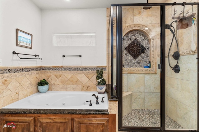 bathroom featuring independent shower and bath