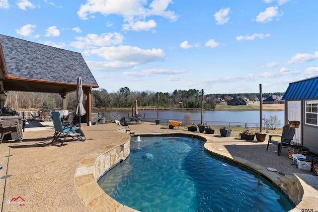 view of pool with a water view, a patio, and pool water feature