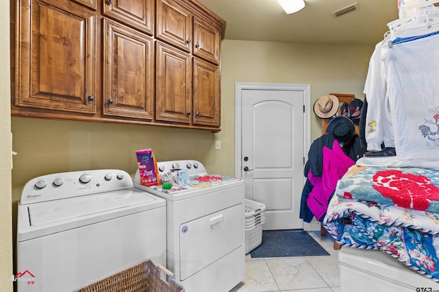 washroom with cabinets and separate washer and dryer