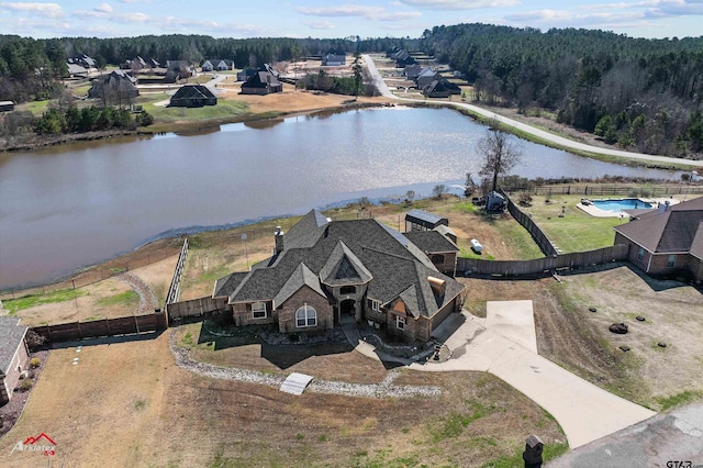 birds eye view of property with a water view