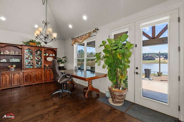 home office with vaulted ceiling, a notable chandelier, a water view, dark hardwood / wood-style flooring, and french doors