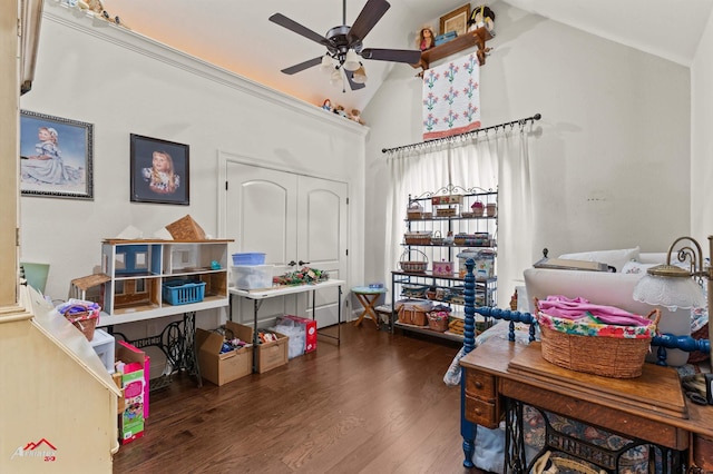 interior space with dark hardwood / wood-style flooring, ceiling fan, and high vaulted ceiling