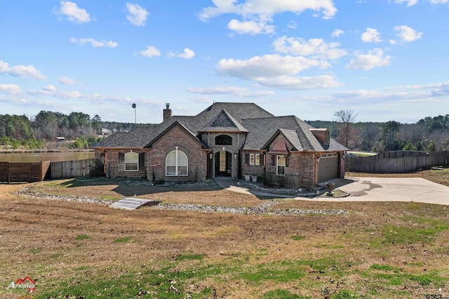 view of front facade with a garage and a front yard