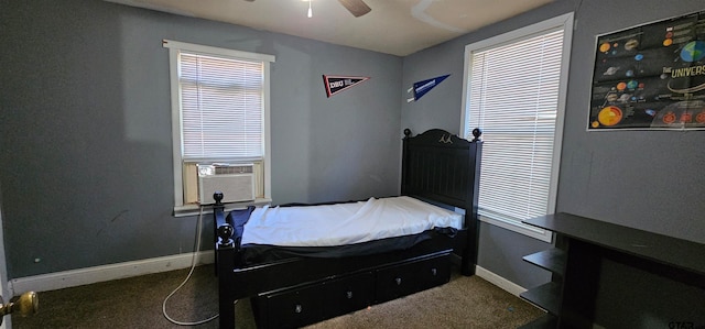 bedroom with ceiling fan, multiple windows, and carpet flooring